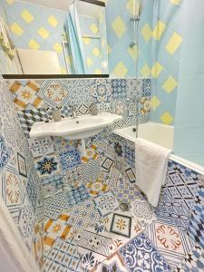 a bathroom with blue and white tiles at Holiday Home in Burgas City