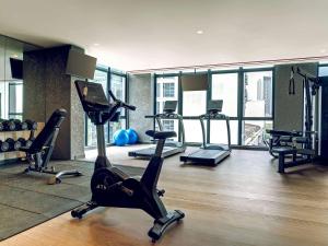 a gym with treadmills and exercise bikes in a room at ibis PJCC Petaling Jaya in Petaling Jaya