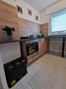 a kitchen with a stove and an oven at 3 Zimmer-Apartment mit Terrasse in Gernsbach