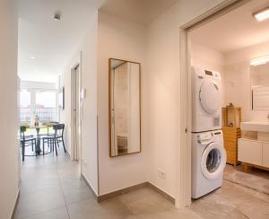 a laundry room with a washer and dryer in it at Apartment Lavendel in Naturno