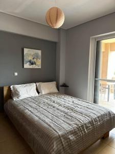 Ένα ή περισσότερα κρεβάτια σε δωμάτιο στο Πολυτελές Διαμέρισμα με Θέα