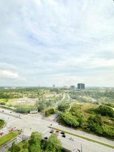 an aerial view of a city street with cars on a road at 1320 Meridin Cozy Legoland Netflix By STAY in Nusajaya
