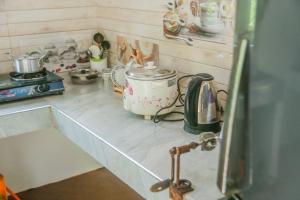 a kitchen with a counter top with a sink at Leafy Villa in Mirissa