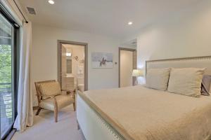 a bedroom with a bed and a chair and a window at Luxurious Home, Walk to Beaver Creek Gondola! in Avon