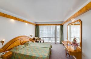 Postel nebo postele na pokoji v ubytování Rubi Hotel