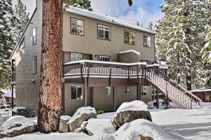 a house with a deck in the snow at Incline Village Retreat Near Skiing and Beaches in Incline Village