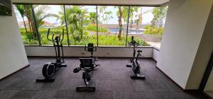 a gym with exercise bikes in a room with a window at Apartment in Citra Plaza Nagoya Lubuk Baja Kota Batam in Nagoya