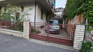 een auto geparkeerd in een garage met een rood hek bij *** Apartment "IN" Zagreb in Zagreb