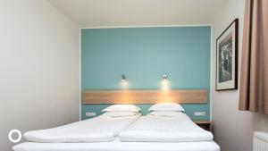 Postel nebo postele na pokoji v ubytování Center Hotels Plaza