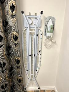 a wall with a ski rack and a mirror at Avers House in Narva
