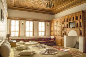 a large room with two beds and a couch at Leyla Hanım Konağı in Safranbolu
