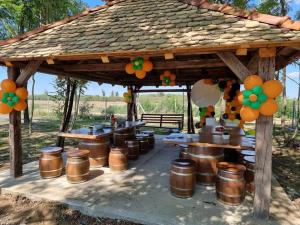 a wooden gazebo with a bunch of drums under it at Kopićland TENT in Marinci