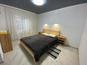 A bed or beds in a room at Vovna