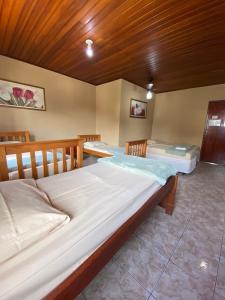 En eller flere senge i et værelse på Pousada Do Pancho