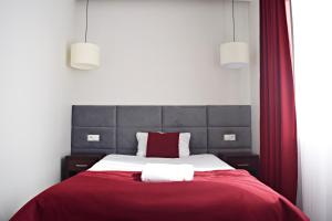 Posteľ alebo postele v izbe v ubytovaní Hotel Maraton