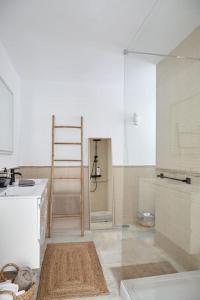 a kitchen with a sink and a ladder in it at Casa Sierra - Mijas Pueblo in Mijas