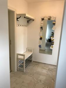 a room with a mirror and a table and a chair at Wohnung mit eigenem Zugang in Hochdorf