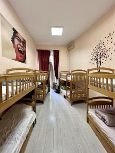 a dorm room with four bunk beds in it at Dja Hostel in Kyiv