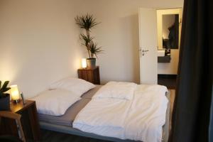 Postel nebo postele na pokoji v ubytování Messe- und Gästezimmer Hildesheim