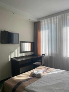 Posteľ alebo postele v izbe v ubytovaní Hotel Maraton