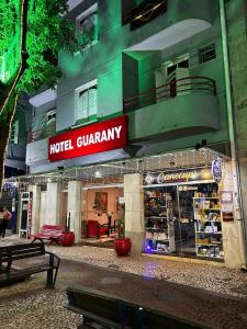 a hotel grannney store in front of a building at Hotel Guarany da Serra in Poços de Caldas