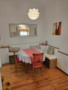 a dining room with a table and a mirror at Can Penjarella I in Arbúcies +6 photos