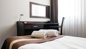 Posteľ alebo postele v izbe v ubytovaní Hotel Maraton