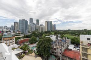 an aerial view of a city with tall buildings at Marvelle Studios in Manila