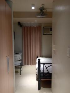 a hospital room with a bed and a sink at Marvelle Studios in Manila