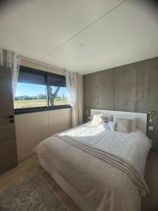 Ένα ή περισσότερα κρεβάτια σε δωμάτιο στο Logement cosy indépendant avec jardin et Parking