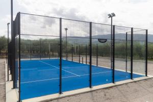 a tennis court with a net at Biancolivo Country House in Altavilla Silentina