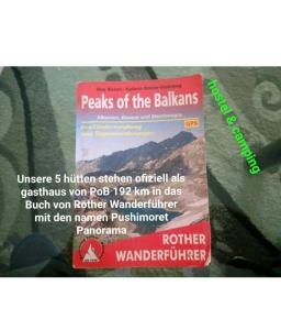 una señal para los sellos de los bilsams en una chaqueta en Peaks of the Balkans Trail 192 km -- Hostel Panorama --, en Peje