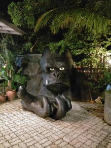 a statue of a gorilla sitting on the ground at Art Villa in Alor Setar