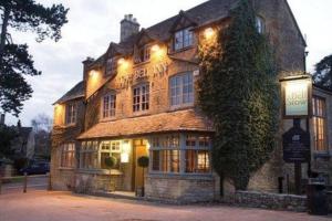 a large building with lights on the side of it at The Cotswold Stowaway, Perfect Luxurious Retreat! in Stow on the Wold
