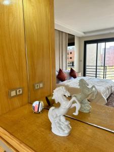 a bedroom with a white horse statue next to a bed at Incantevole villa Safi Sidi Bouzid near beach in Safi