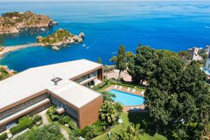 an aerial view of a house with a swimming pool at Mon Repos Avenir in Taormina