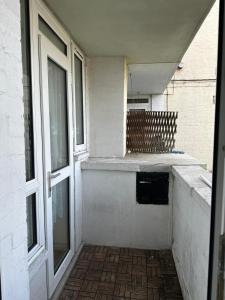 an empty room with a window and a building at Spacious 2 bed flat (Free WiFi) Free Parking in Barking