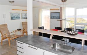 a kitchen with a sink and a counter top at Amazing Home In Rm With Wifi in Bolilmark