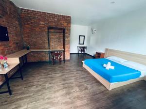 Postel nebo postele na pokoji v ubytování Big Dreams Garden Stay