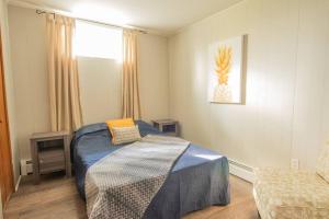 Ένα ή περισσότερα κρεβάτια σε δωμάτιο στο Chalet BIA Foyer & Spa