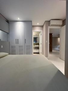 Ένα ή περισσότερα κρεβάτια σε δωμάτιο στο MINHA CASA NA PRAIA