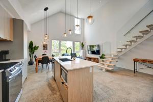 an open kitchen and living room with a staircase at TripMontreal 302 in Montreal