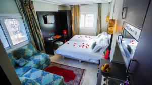 Postel nebo postele na pokoji v ubytování Palais Riad Reda & Spa