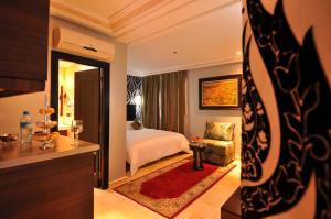 Postel nebo postele na pokoji v ubytování Palais Riad Reda & Spa