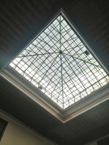 a large glass skylight in a ceiling at Riad Mtamer, Tetouan in Tetouan