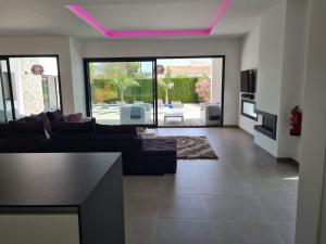 a living room with a couch and a table at Moraira B5 in Moraira