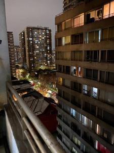 a view of a tall building from a window at Apartamento centro Santiago vacaciones trabajo in Santiago