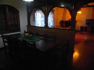 a dining room with a table and chairs in a church at Villaggio D'Amore in Monte Verde +19 photos