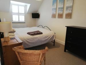 Postel nebo postele na pokoji v ubytování Cwtch Cottage-sleeps 6