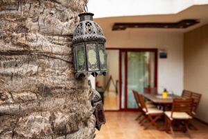 a lamp hanging on the side of a wall at Apartamento Balandros in Palm-mar